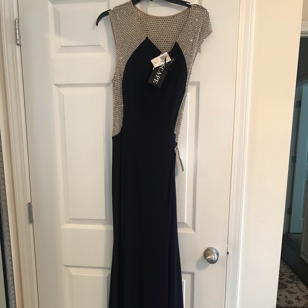 Long navy blue evening mermaid gown. Sparkly back.